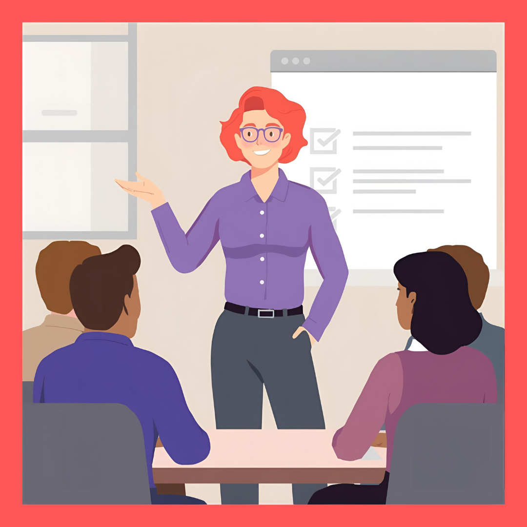 Skipalis Training & Consultation: Person with short, wavy, coral pink hair, fair skin, glasses, a long-sleeved purple shirt, and charcoal grey pants in front of a presentation screen with four people sitting at a table facing the presenter.